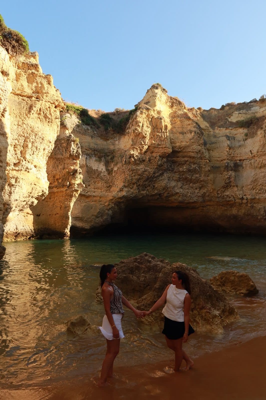 Guests swimming at a cove beach on the Albufeira coast