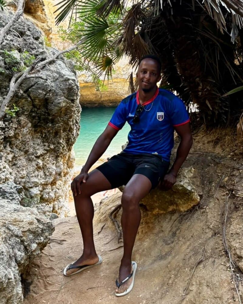 Tiago at one of the hidden coves near Albufeira, the water behind him